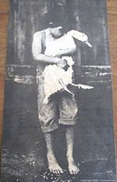 Front view showing child holding snow goose photograph