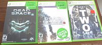 Front view of all three Xbox 360 game cases