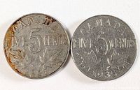 Both 1927 and 1935 Canadian 5-cent coins, obverse side showing denomination and date