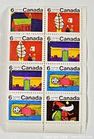 Full view of eight-stamp block showing all designs