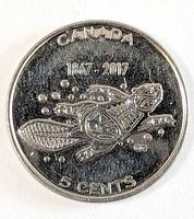 Reverse side showing turtle design, bubbles, dates and denomination