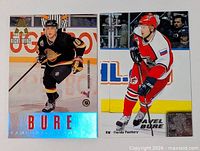 Front view of both Pavel Bure hockey cards side by side