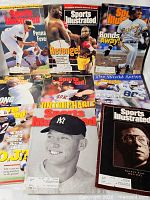 Seven of the nine Sports Illustrated magazines laid out showing various covers including Bonds, Jeter, Ashe, boxing and Pennant Fever issues