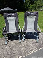 Front view of both Eureka high-back folding camping chairs standing side by side