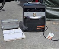 Air fryer unit with rotating basket, retrieval rack/tool and manual shown together