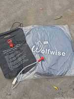 Shower bag and folded WolfWise tent together