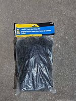 Front view of sealed Power Fist cargo net package