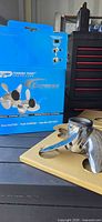 propeller resting in cardboard insert beside original Turning Point Express box