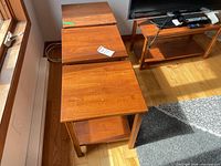 Top view of three end tables and partial TV stand