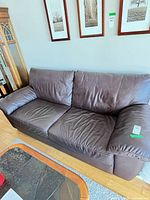 Front view of dark brown IKEA sofa