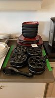 stacked bowls, plates, escargot dishes, spoon rack