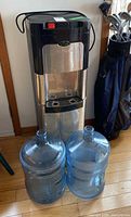 Front view of ViVA water cooler dispenser with two 5-gallon bottles