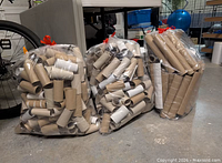 Three clear bags filled with cardboard tubes