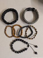 Top view all seven bracelets arranged on surface