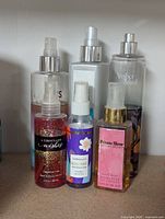 Front view showing all six spray bottles