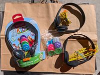 All items: sealed Maxell Kids Action headphone pack, two loose headphones, bag of colour caps