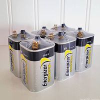Six Energizer Industrial EN529 6V batteries standing, terminals visible