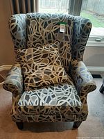 Front view of wingback chair with pillow