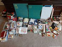 wide shot of entire lot showing cutting mats, fabric bins, notions and tools