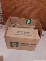 Closed cardboard box showing overall lot