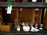 Shelf view showing multiple Christmas collectibles