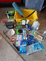 All items laid out including caddy, detergents, Swiffer boxes, sponges and accessories