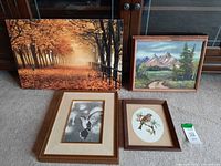 All four artwork pieces arranged on floor