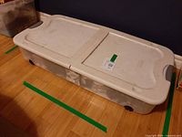 Closed under-bed plastic tote with lid