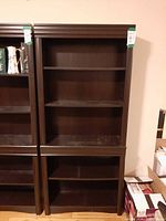 Full frontal view of the bookcase showing shelves and moldings