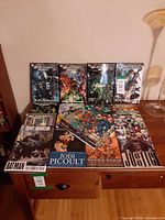 Overall lot showing standing Blackest Night volumes and front row of other trades with stack of single issues