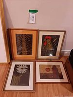 Four framed prints grouped together