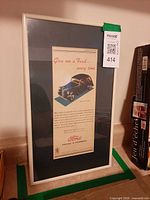 Full view of framed Ford Prefect advertisement