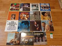 Full layout of all vinyl record jackets on floor