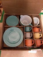 Interior view of divided box showing all pastel glass pieces