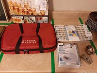 Overview of all items on countertop: carrier, dish rack, scale box, cookie cutters