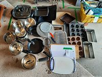 Overview of assorted cookware, pots, pans, baking items