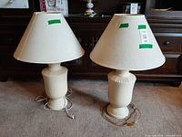 Front view of both ceramic lamps with shades