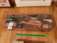 Roberts laminate cutter in closed carton on floor