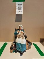Front view of Royal Doulton Nanny figurine showing full scene