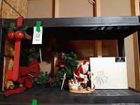 Entire lot on shelving: wreath, red hanger, Santa’s List figurine, Royal Doulton box