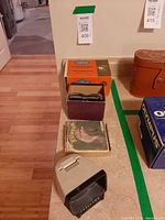 Overall lot showing three viewers and box of reels