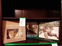 Front view of all three Robert Bateman hardcover art books on shelf