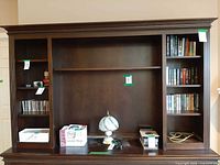 Front view of wooden entertainment unit top showing shelves and TV cavity