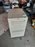 Front angled view showing two drawers and overall wear