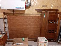 Overall view of both bedframes parts leaned against wall