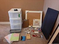 Overall lot view showing plastic drawers, boards, papers, adhesives and accessories