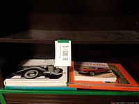 Shelf showing all four automotive books