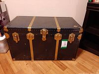 front view of closed trunk showing hardware and slats