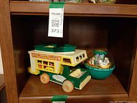 Overall view of camper with boat and chime ball on shelf