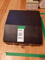 Closed black carrying case with latch